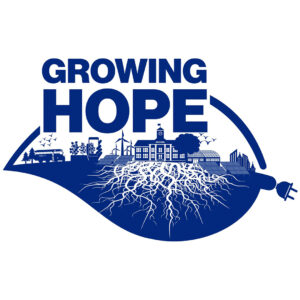 Growing Hope logo. Blue design with text and images. Inside the leaf you can see trees, a school bus, birds, plants, a hand holding a mobile phone, solar panels, wind turbines, a school, a greenhouse and a city skyline. White roots are coming out from underneath the school. The end of the leaf, where it would attach to a branch, has an electric plug. At the top of the logo breaking the upper edge of the leaf’s outline is text in capital letters “Growing Hope.”